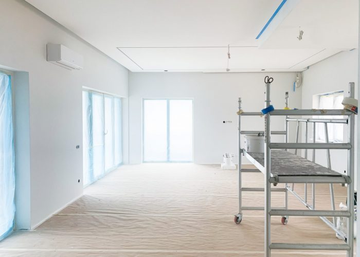 Home renovation in the process, preparation of painting new bright room