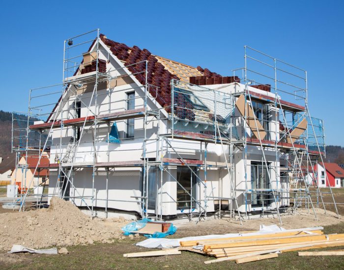 Construction of a new prefabricated house - stone and wood.